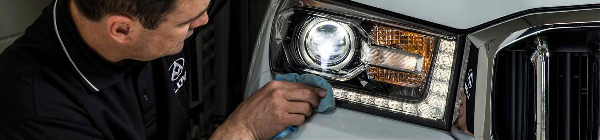 LDV employee cleaning a headlight